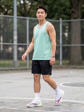 Allpro Nitro 2 – An on-court performance look featuring black athletic mesh shorts, a moisture-wicking mint green tank top, and crisp white crew socks to highlight the sneaker's vibrant accents.
