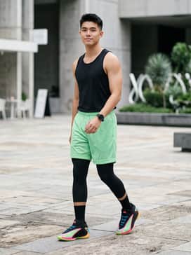 A full-court performance ensemble featuring a black moisture-wicking tank top and neon green mesh basketball shorts to echo the shoe's outsole.