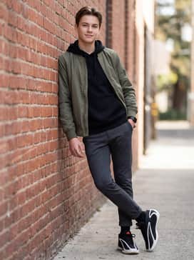 Anthony Edwards 2 Shoes Kids – Slim-fit dark denim jeans rolled slightly at the cuff, worn with a crisp white long-sleeve tee and a lightweight nylon bomber jacket.