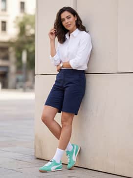 Arizona Nylon Womens Sneakers – Navy blue tailored chino shorts and a crisp white button-down shirt for a smart-casual summer ensemble.