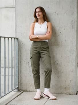 Arizona Wine Club Womens Sneakers – Tapered olive cargo pants paired with a cropped white ribbed tank top and gold jewelry to complement the sneaker's gold foil branding.