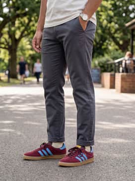 Tapered stone-colored chinos worn with a tucked-in burgundy polo shirt to echo the rich color palette of the sneakers for a smart-casual weekend.