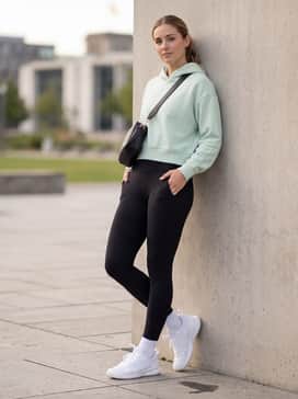 Avaflash Tennis Shoes – High-waisted black leggings combined with a cropped pastel hoodie and a sleek crossbody bag for the ultimate functional athleisure vibe.