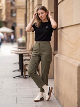 High-waisted olive green cargo trousers and a tucked-in black graphic tee to lean into the earthy tones of the gum sole.
