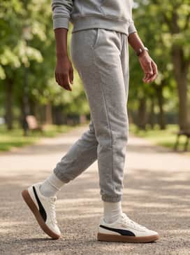 A tonal loungewear set in oatmeal or heather grey, featuring tapered joggers and a matching hoodie for an elevated 'off-duty' vibe.