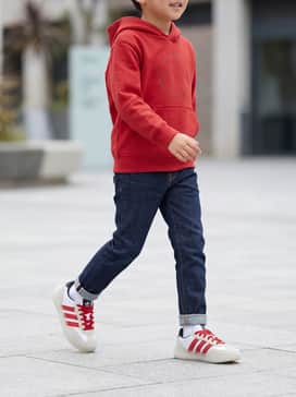 Barreda Decode Shoes Kids – Pair with slim-fit indigo jeans and a bright red graphic hoodie to mirror the shoe's accent color for a coordinated streetwear look.