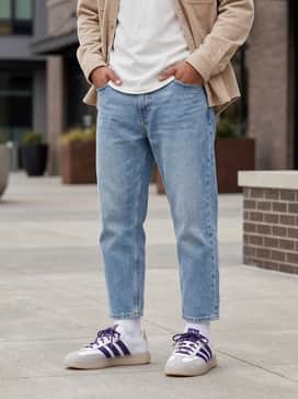 Light-wash straight-leg jeans with a crisp white t-shirt and an open beige corduroy overshirt to complement the shoe's neutral accents.