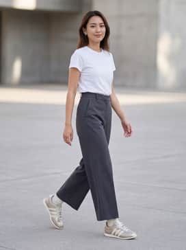 Pair with high-waisted charcoal grey wide-leg trousers and a crisp white tucked-in baby tee for a sophisticated, balanced look.