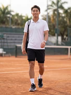 Barricade 14 Clay Tennis Shoes – A high-performance white tennis polo paired with black moisture-wicking athletic shorts and white crew-length sports socks for a classic court-ready look.