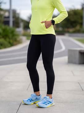 For cooler morning runs, pair with black high-compression thermal leggings, a neon yellow quarter-zip mid-layer, and a sleek navy moisture-wicking headband.