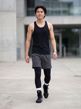 Box Hog 4 Shoes – A performance-focused look featuring black compression tights, a dark charcoal moisture-wicking racerback tank, and white crew socks tucked into the boots.