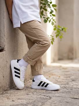 Cuffed khaki chinos styled with a crisp white polo shirt for a clean and smart-casual school uniform vibe.