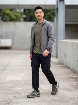 Pair with black technical cargo pants, a moisture-wicking olive green tee, and a lightweight grey windbreaker for a complete utility look.