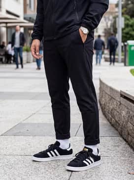 Combine with black tapered joggers, a technical windbreaker, and a baseball cap for a cohesive athletic streetwear ensemble.