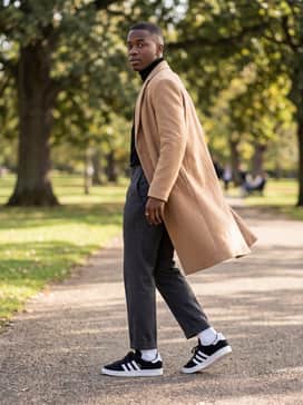 Match with charcoal grey wool trousers, a black turtleneck, and a long camel overcoat to achieve a sophisticated high-low fashion aesthetic.