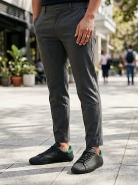 Clot Stan Smith Shoes By Edison Chen – Charcoal grey tapered chinos and a black cashmere turtleneck for a sophisticated, monochromatic look that allows the sneakers to be the focal point.