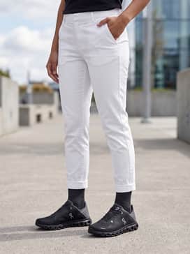 Style with dark-wash slim-fit denim, a classic white t-shirt, and an unbuttoned navy overshirt for a refined casual weekend ensemble.