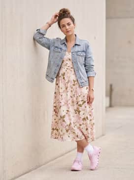 Cloud 6 Shf – A floral midi dress in soft tones with a light-wash denim jacket to create a sporty-chic weekend ensemble.
