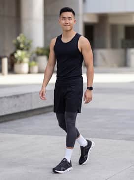 Cloud X 4 Ad – A high-performance look featuring charcoal moisture-wicking athletic shorts, a fitted black compression tank, and white crew socks to highlight the shoe's silhouette.