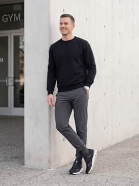 Cloud X 4 Ad – A relaxed weekend outfit consisting of tapered navy joggers, a crisp white heavyweight cotton tee, and an unzipped olive bomber jacket for a layer of urban style.