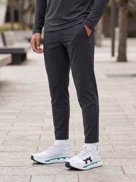 Cloudboom Zone – Dark charcoal tapered joggers in a lightweight technical fabric with a fitted charcoal long-sleeve performance top for cool-weather warmups.