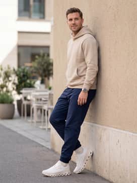 For a relaxed weekend vibe, style them with navy blue nylon track pants, a structured sand-colored hoodie, and a minimalist silver sports watch.