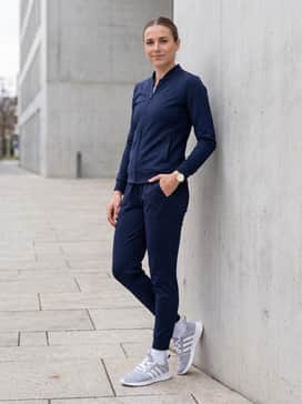 Cloudfoam Pure 20 Shoes – A sleek navy blue monochromatic tracksuit with tapered joggers and a matching slim-fit track jacket for a polished, sporty travel ensemble.