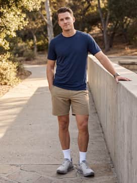 Combine with durable khaki hiking shorts, white crew-length performance socks, and a navy blue breathable technical t-shirt for warm-weather excursions.