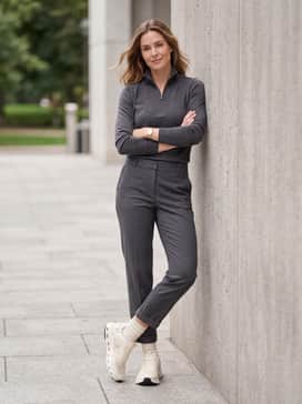 Cloudnova Form 2 Tt – Tapered black joggers and a fitted technical quarter-zip pullover in a sage green hue, creating a streamlined and functional outfit perfect for airport travel or long commutes.
