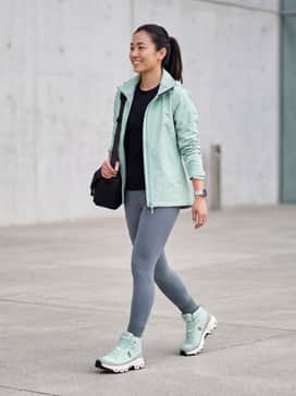 Pair these boots with slate grey moisture-wicking compression leggings, a black thermal base layer, and a matching mint green technical waterproof shell jacket for a coordinated professional hiking look.