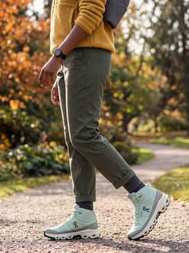 Create an earthy autumn ensemble with deep olive utility pants, a mustard yellow high-pile fleece pullover, and a charcoal grey ribbed beanie to complement the mint and sage tones of the shoe.