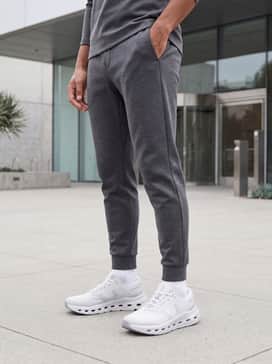 Cloudrunner 3 – A premium athleisure ensemble consisting of charcoal grey tapered joggers, a crisp white heavyweight cotton t-shirt, and a matching grey zip-up tech-fleece hoodie for a coordinated, clean aesthetic.