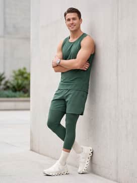 For a dedicated running session, style them with forest green compression tights, a matching moisture-wicking tank top, and white athletic crew socks to highlight the architectural sole.
