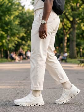 Cloudswift 4 Ad – Achieve a modern urban aesthetic by wearing the sneakers with tapered olive cargo pants, a cream-colored oversized heavyweight hoodie, and a minimalist black technical backpack.