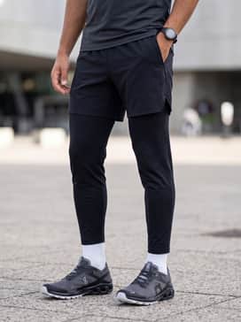 Cloudventure Peak 3 – Men's 5-inch split running shorts in matte black, a silver-grey performance tech tee, and high-performance crew socks in white to coordinate with the outsole.