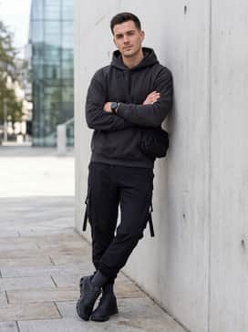 Cloudzone – Style with black cargo joggers featuring strap details, an oversized graphic hoodie in a muted tone, and a sleek crossbody bag for a modern tech-inspired aesthetic.