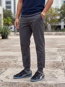 Combine with tapered charcoal chinos, a tucked-in navy blue knit polo, and a matching gold-tone watch to complement the shoe's accents.