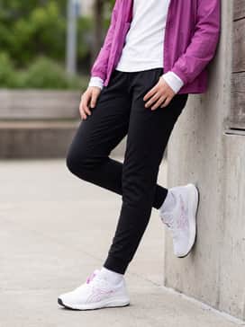 Contend 9 Grade School – Black tapered joggers combined with a crisp white long-sleeve performance tee and a lightweight zip-up windbreaker in a matching purple hue for cool-weather activities.