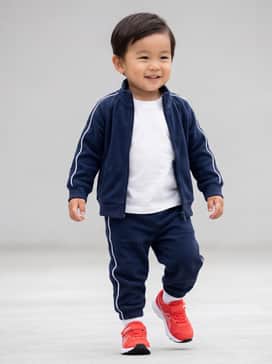 A navy blue fleece tracksuit with white side-stripes and a soft cotton tee for a coordinated sporty look.