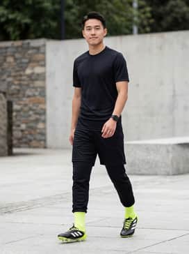 Copa Pure 3 Elite Firm Ground Cleats – A professional match-day look featuring a black moisture-wicking team jersey, matching technical shorts, and high-performance soccer socks in solar yellow to highlight the cleat's accents.