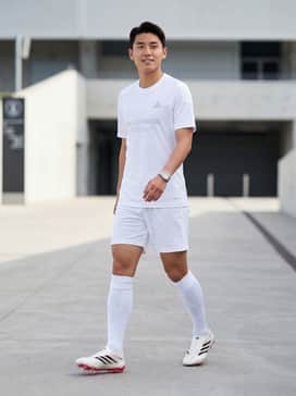 A professional match-day kit featuring a white moisture-wicking performance jersey, matching athletic shorts, and white compression-fit soccer socks for a clean, unified look.