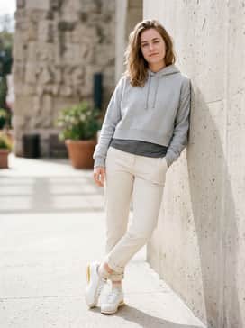 Cortez Leather – A floral midi dress in soft pastel tones, layered with a cropped light grey hoodie for a balanced feminine-meets-sporty aesthetic.