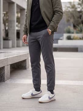 Combine with tapered charcoal joggers, a fitted black hoodie, and a structured olive bomber jacket for a modern urban vibe.