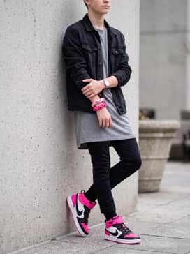 A gray jersey t-shirt dress accessorized with a black denim jacket and pink hair ties to pull the color theme together.