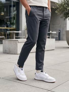 Court Classic Lux Suede – Slim-fit charcoal trousers paired with a cream-colored cashmere sweater for a sophisticated monochromatic look that highlights the shoe's textures.