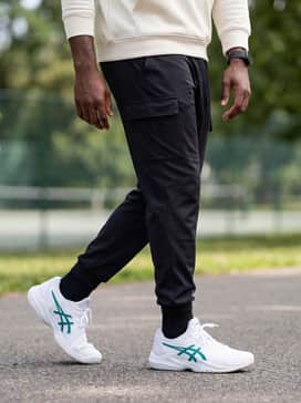 Court Ff 3 Novak – Black technical cargo pants and a neutral cream-colored oversized hoodie for a modern streetwear vibe that leans into the shoe's chunky silhouette.