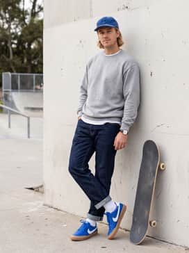 Vintage Streetwear: Combine with light-wash distressed denim, an oversized grey hoodie, and a matching blue baseball cap for a relaxed, retro vibe.
