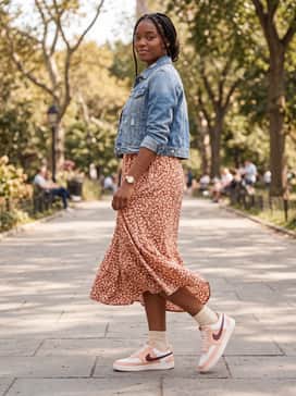 Court Vision Low – A floral-print midi dress in shades of terracotta and cream, topped with an oversized denim jacket for an effortless, feminine-meets-streetwear vibe.