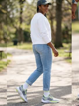 Relaxed weekend: Wear with athletic-fit light wash denim jeans, a white crewneck sweatshirt, and a neon-accented baseball cap for a cohesive, casual aesthetic.