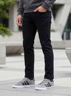 Daily 30 Shoes – Black slim-fit denim jeans with a charcoal grey hoodie and a khaki bomber jacket for a modern urban aesthetic.